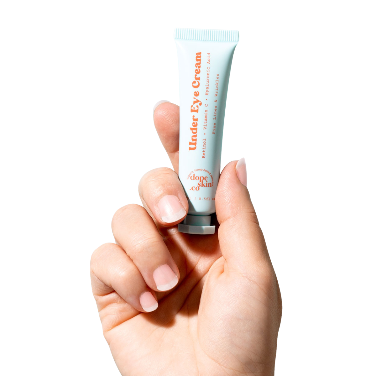 Image of hand holding tube of Dope Skin Co Retinol Under Eye Cream