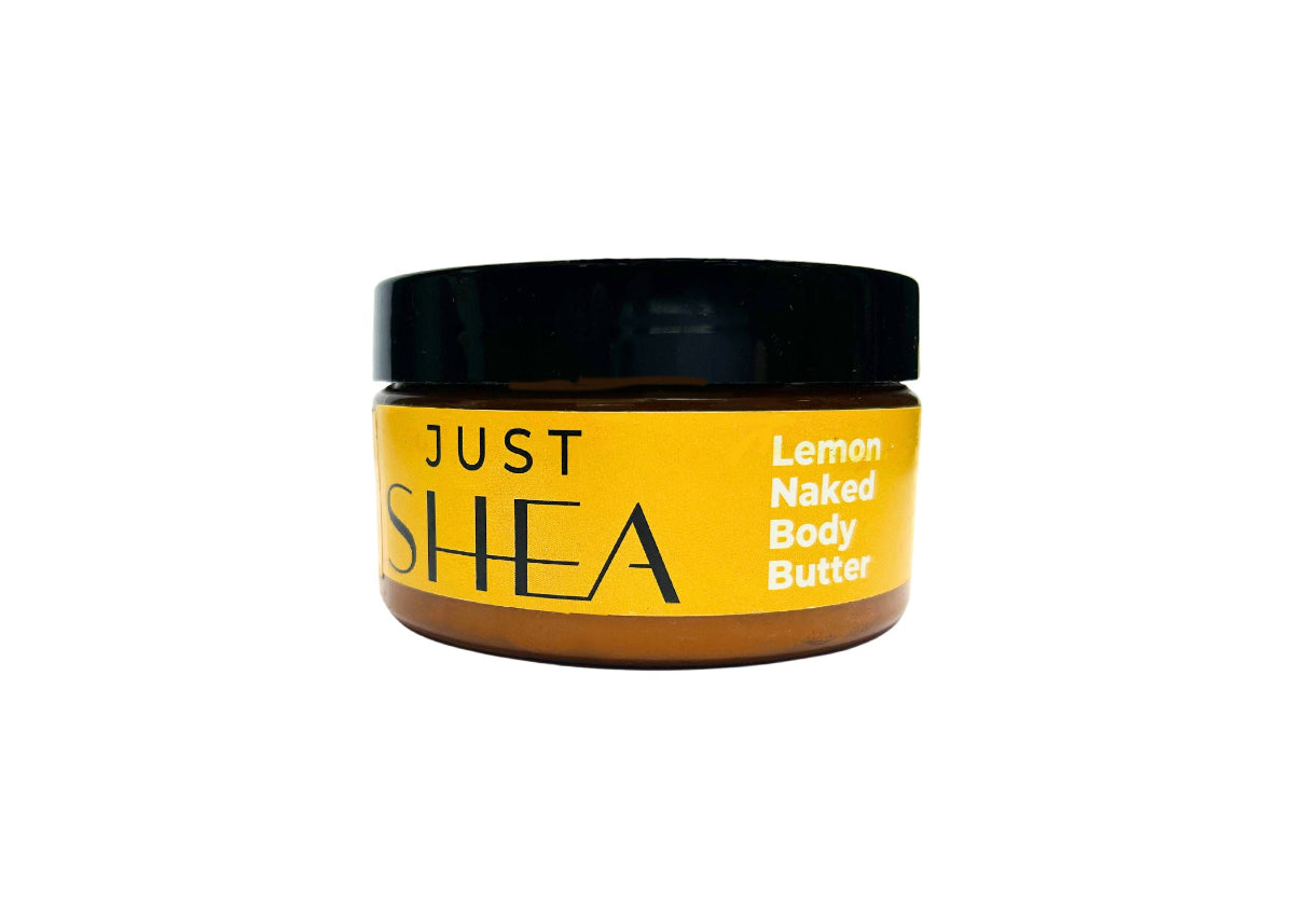 A jar of Just Shea Naked Lemon Body Butter with a black lid and a label that includes the product name and the scent, Lemon Naked Body Butter.