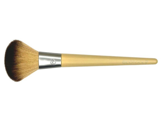 An Eco Tools blusher brush with a beige handle and synthetic domed bristles, designed for applying blush to the cheeks.