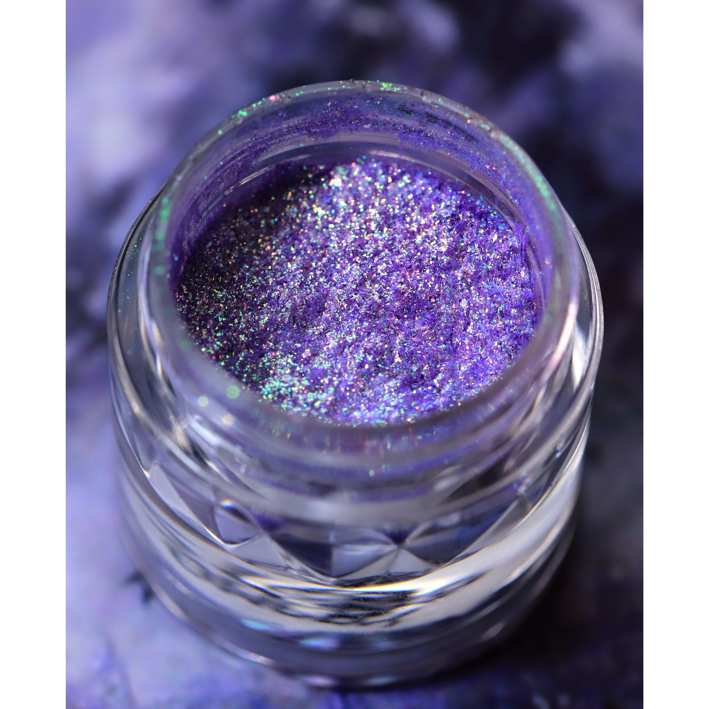 Jar of purple glitter on a purple background