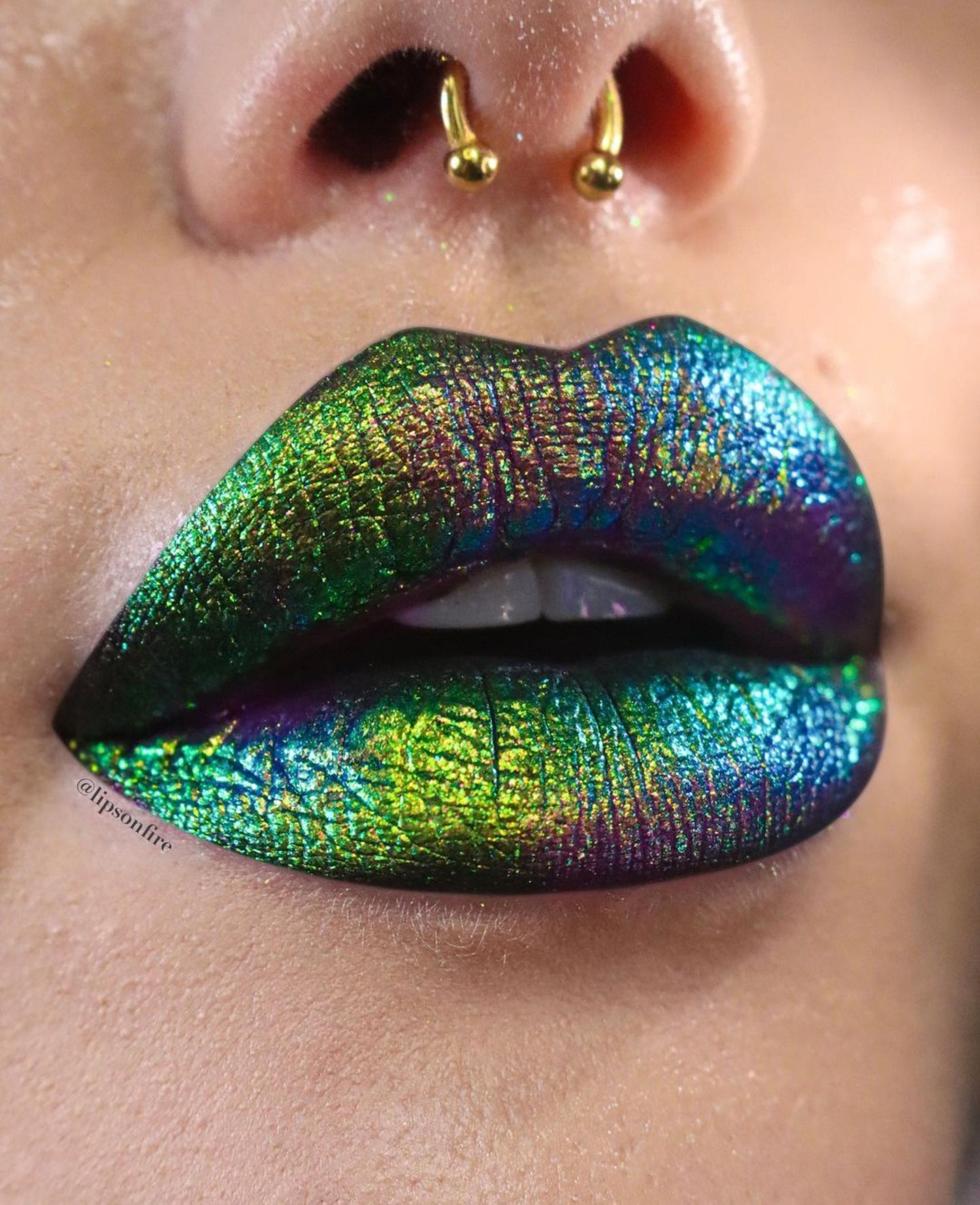 Close-up of lips with iridescent green and blue lipstick
