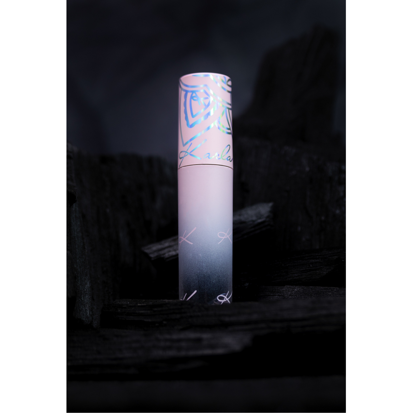 Pink tube with a gradient design on a dark background