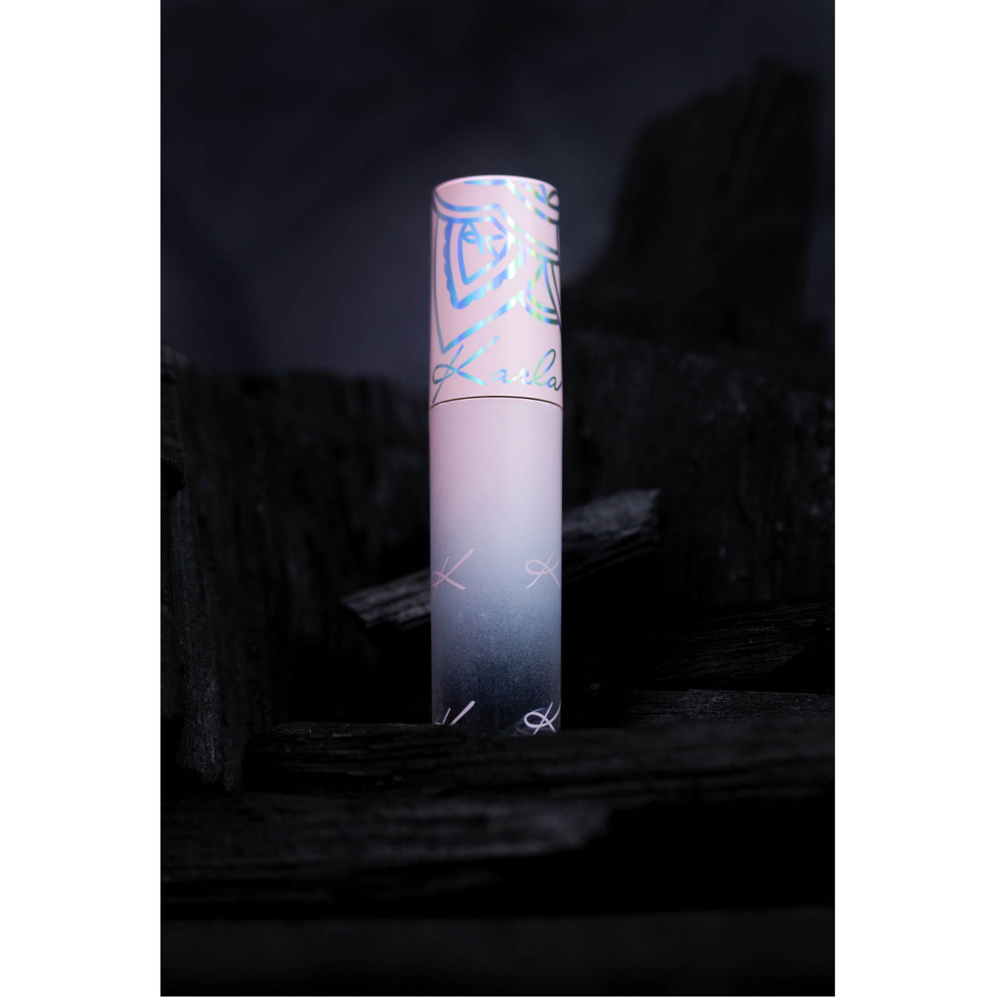 Pink tube with a gradient design on a dark background