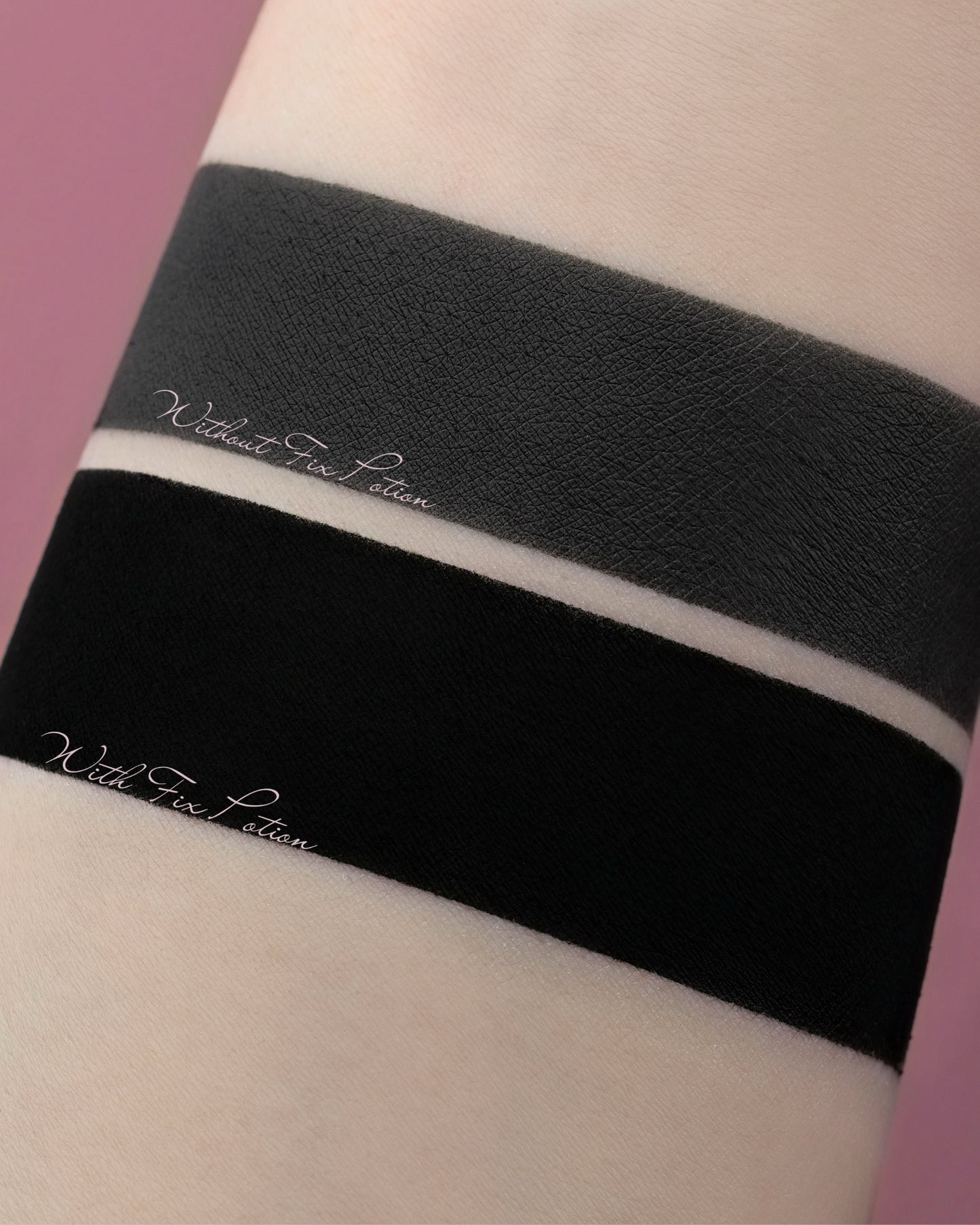 Black swatches of Shadow Potion Paint on an arm, one deeper than the other. Labelled without fix potion and with fix potion.
