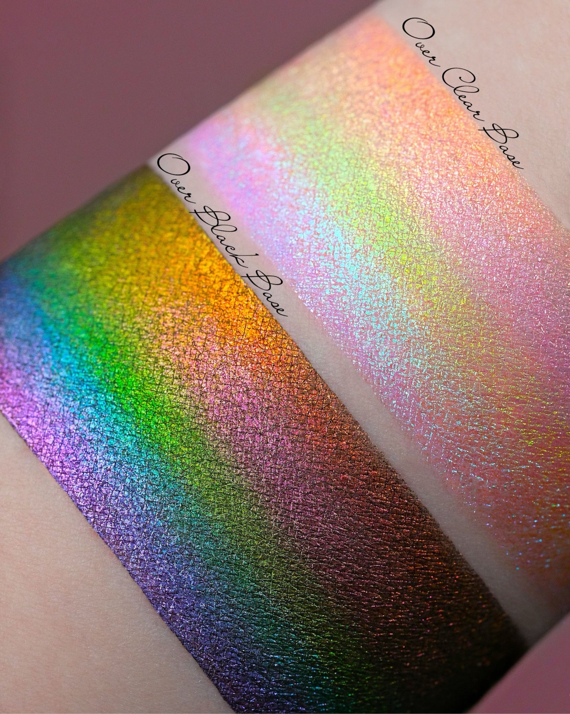 Arm with swatches of eyeshadow over a black base and over a white base