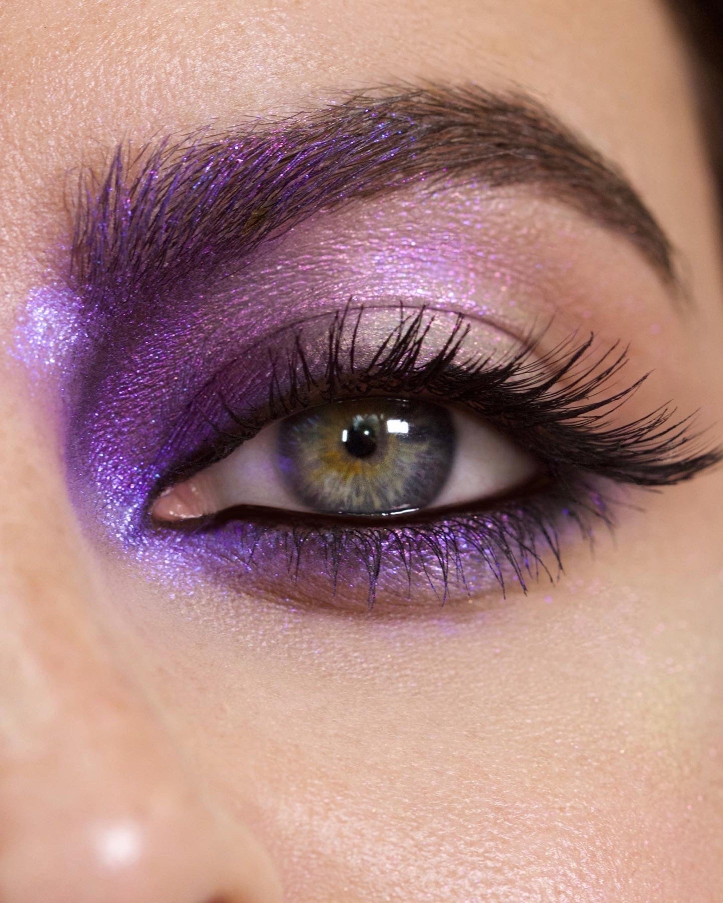 Close-up of a eye with purple makeup