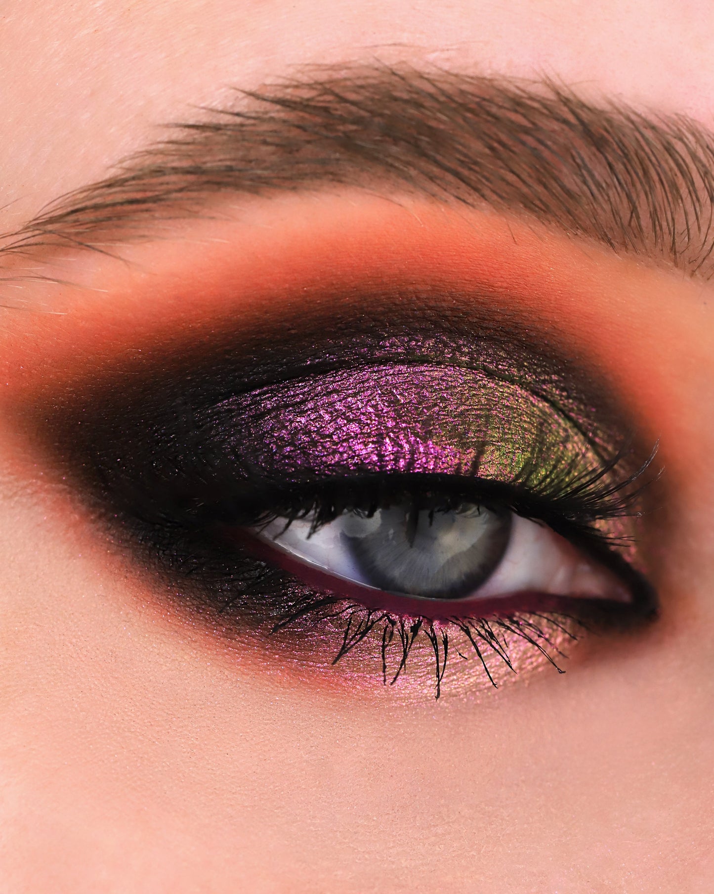 Close-up of a eye with Rockabye Baby on a black eye base