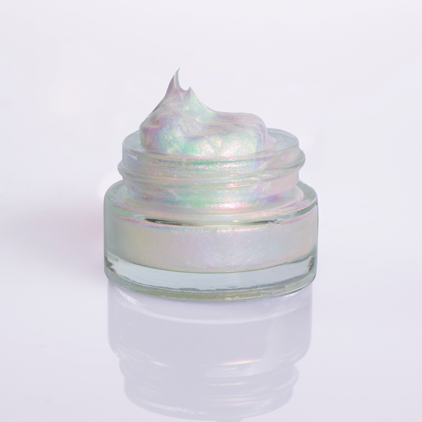 Iridescent eye shadow gel in Rockabye Baby in a small glass jar on a white background