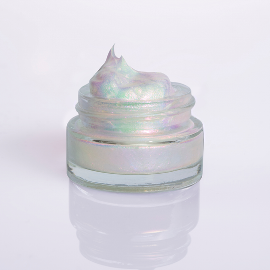 Iridescent eye shadow gel in Rockabye Baby in a small glass jar on a white background